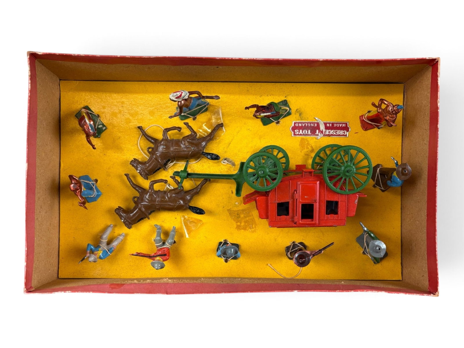 Crescent Cowboys & Indians Boxed Set: Large Crescent Toys Cowboys and Indians set in its original box. Most pieces remain tied into the original packaging. Includes a stagecoach with two horses and 11 additional figures. Figures are in