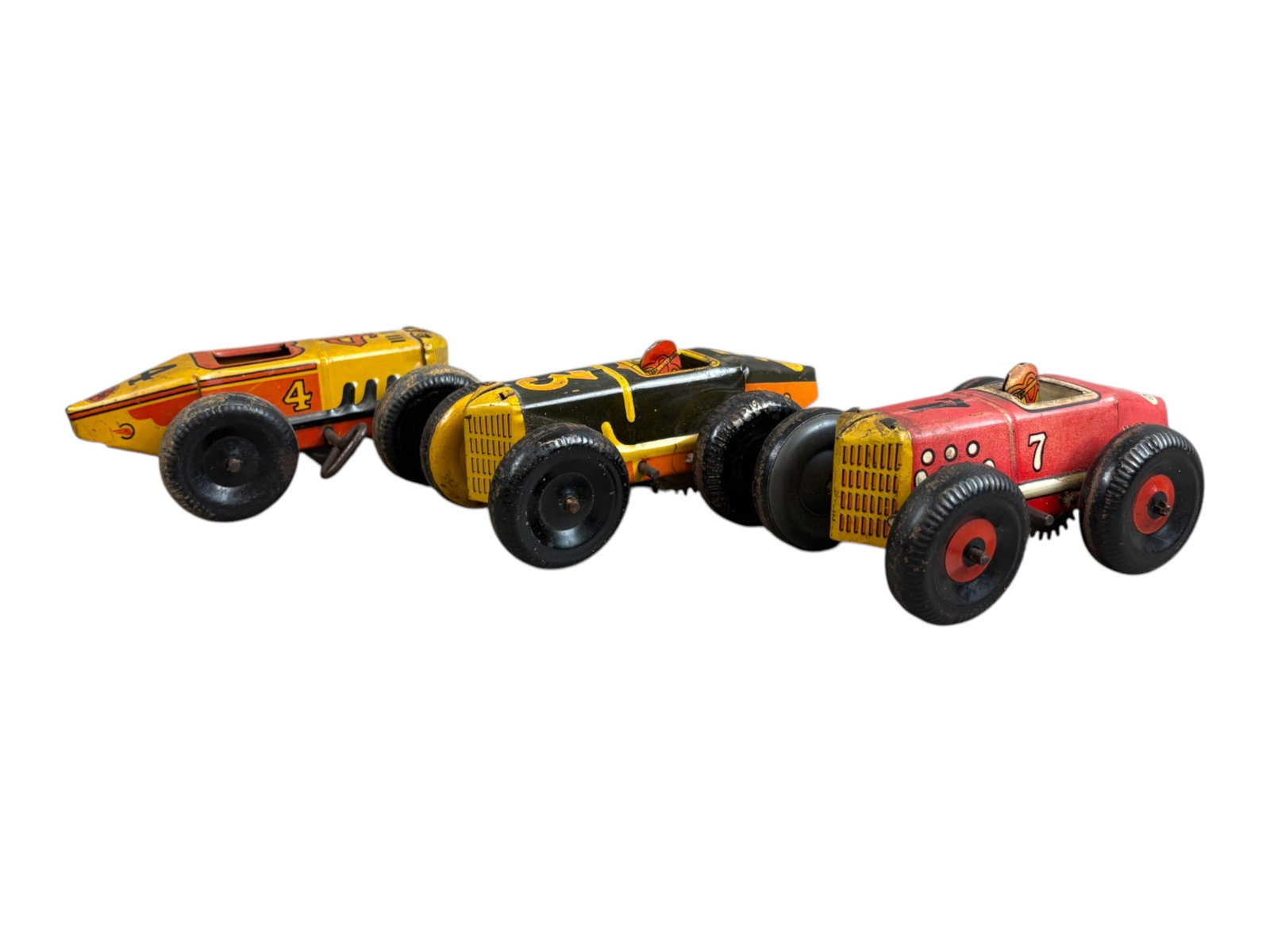 (3) Marx Tin Litho Wind Up Race Cars: Each approx 5" long. One is missing a driver. The windup mechanism on each is not working. All show playwear with paint loss, scuffs, and scratches. Shipping: Weiss Auctions offers full-service, in-ho