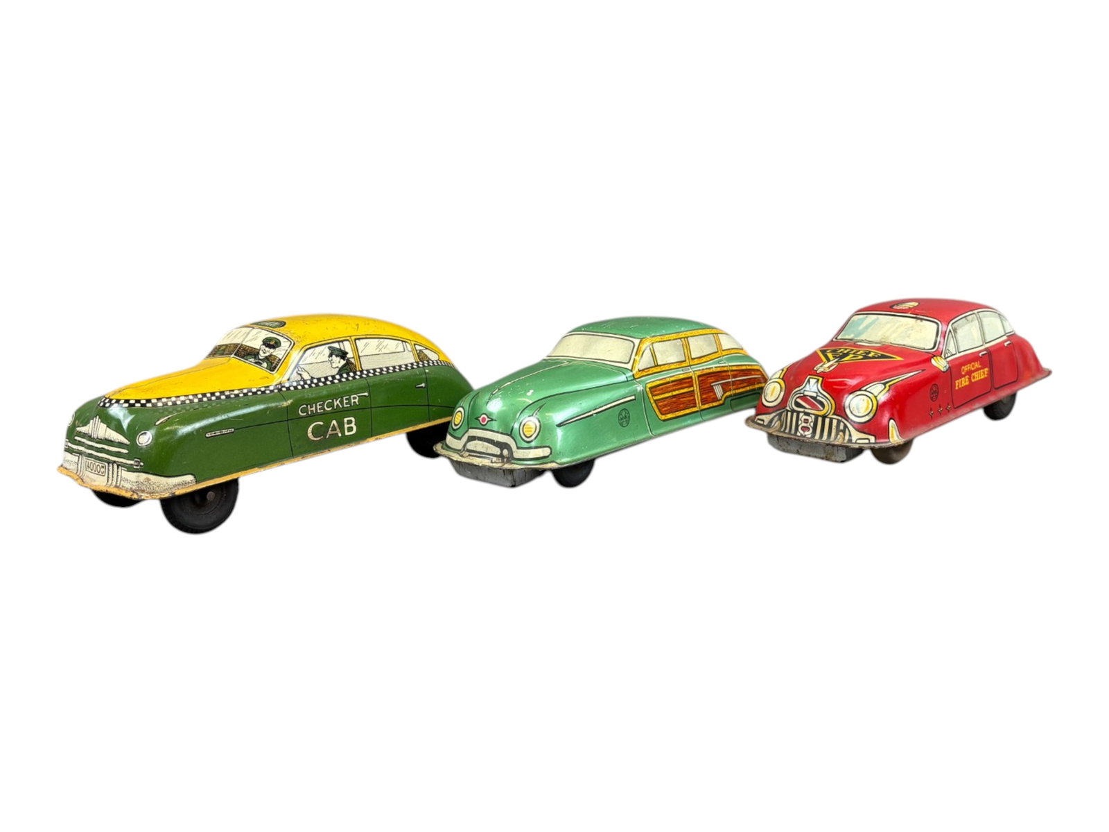 (3) Tin Litho Cars, Marx & Courtland: Includes Marx Fire Chief (friction), Marx Woody Wagon (windup), and Courtland Checker Cab (windup). Each approx. 7" long. The two windup cars are not working, and the friction wheels are very tight. A