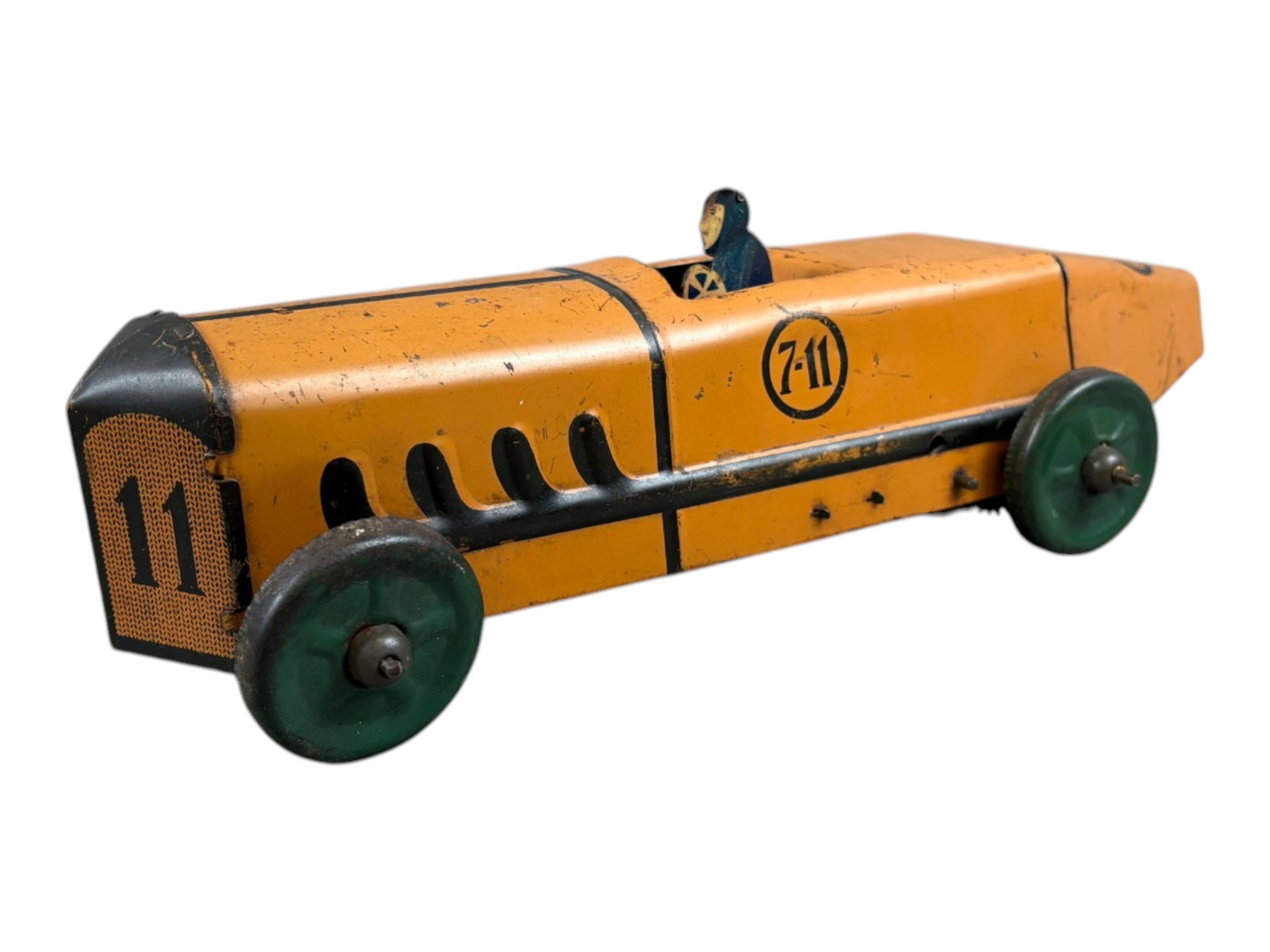 Early Marx Tin Litho Windup 7-11 Racer: Approx. 12" long. Features tin litho diecut driver. Windup mechanism works intermittingly and sometimes needs coaxing to get going. Shows playwear with scuffs and scratches. Shipping: Weiss Auctions o