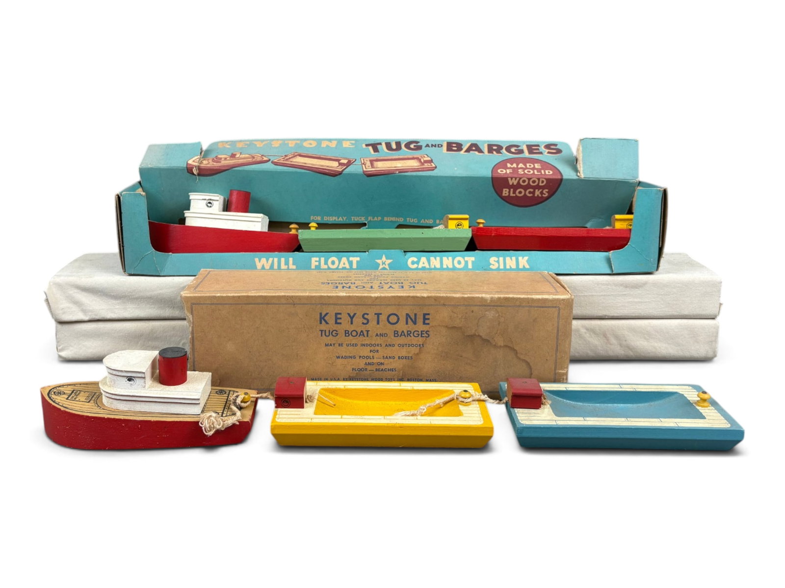 (2) Boxed Keystone Tug Boats and Barges: Lot of (2) wooden Keystone playsets, "Tug Boats and Barges". Both are complete and show light playwear. Each comes in the original box. Boxes show some edge/corner wear, creases, tears, etc. The