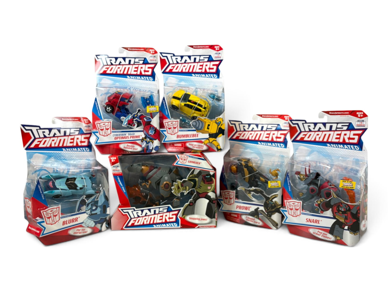 (6) Sealed Transformers Animated Action Figures: Hasbro, 2008. Group of 6 Sealed, New in Package Transformers Animated action figures. Includes Grimlock, Snarl, Prowl, Bumblebee, Blur, and Optimus Primce. Packing to each may show edge and corner