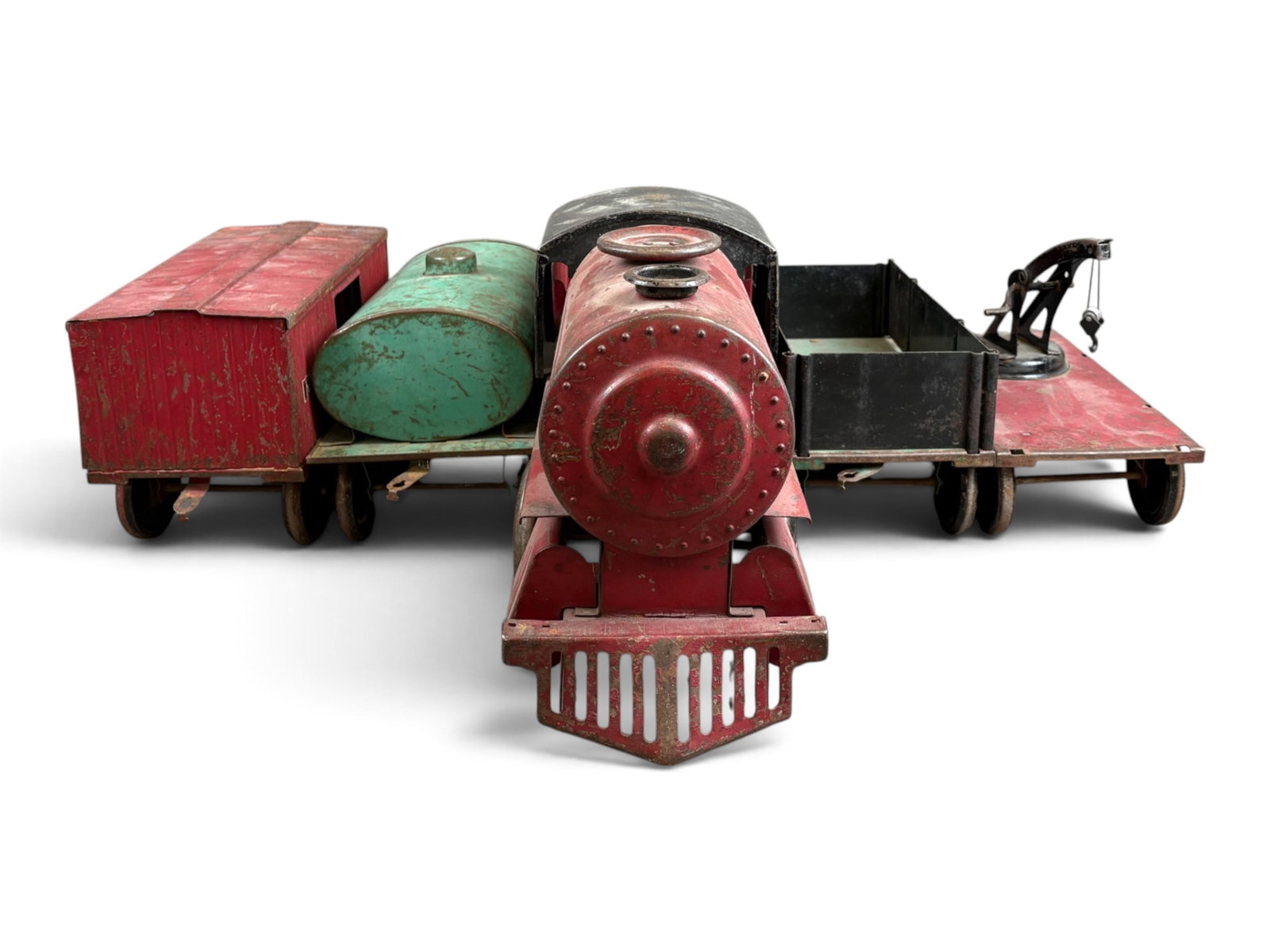 Cor Cor Pressed Steel Train Set: Large scale, consisting of 5 pieces including Twentieth Century Limited locomotive, NYC R.R. box car, derrick car (Lionel hook), Erie gondola, and C&O tank car. All pieces show overall wear with scuff