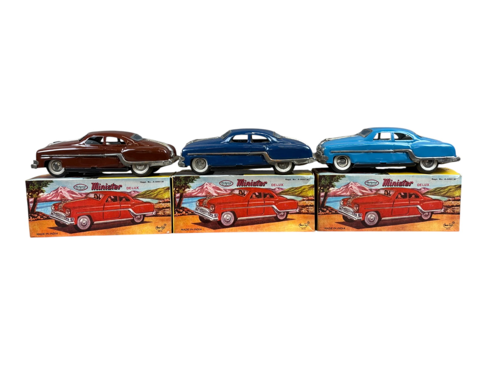 (3) Boxed Minister Delux Friction Toy Vehicles: Amar Toys, made in India. Group of (3). Friction powered. Each shows light playwear with scuffs and scratches. Original boxes show some edge/corner wear. Shipping: Weiss Auctions offers full-service, 