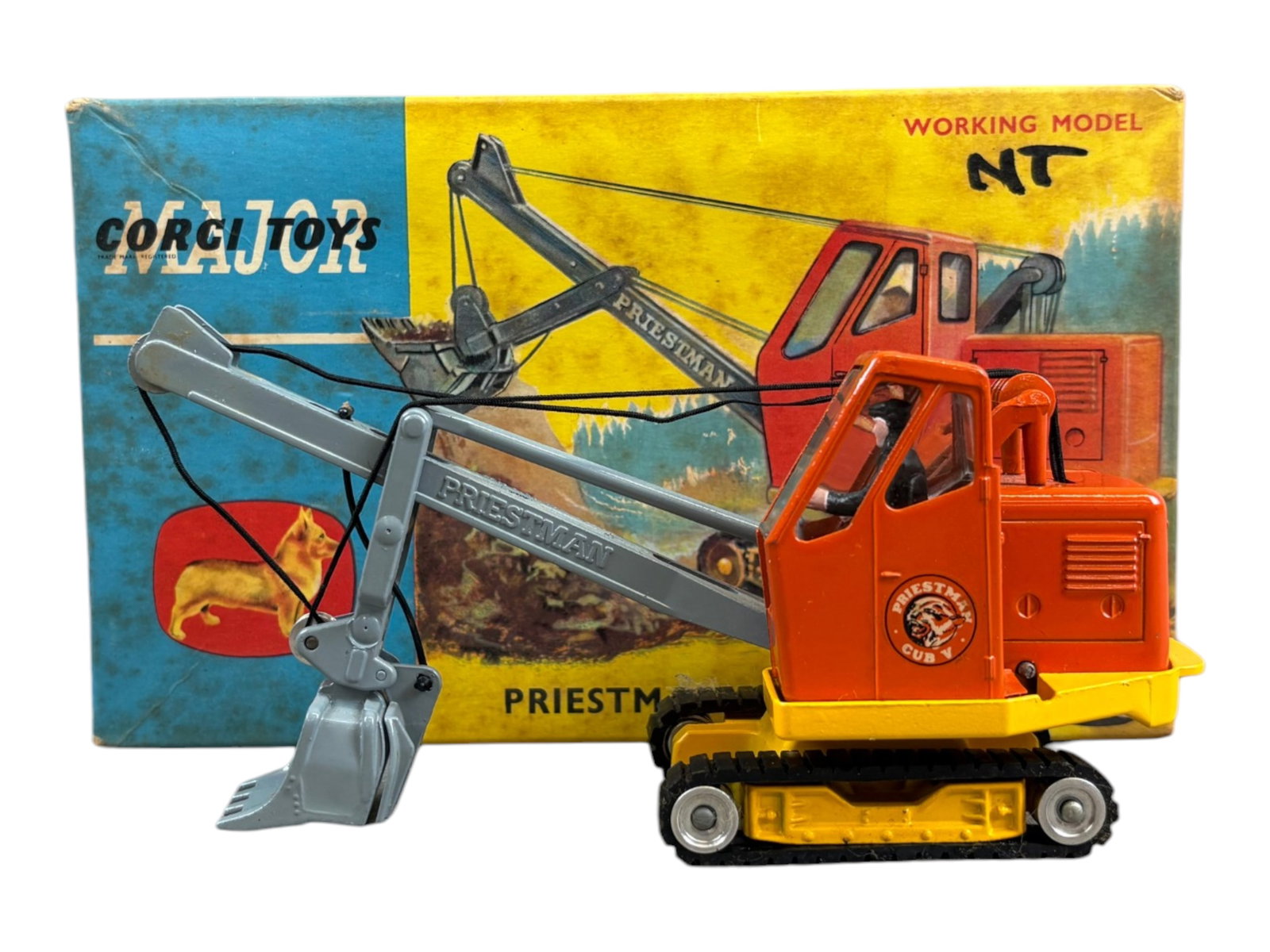 Corgi Toys 1128 Priestman Cub Shovel in Orig Box: Orange and Yellow with treads. Shows very light playwear. Housed in the original box with styrofoam insert. Box cover is dirty with some staining and soiling. Shipping: Weiss Auctions offers