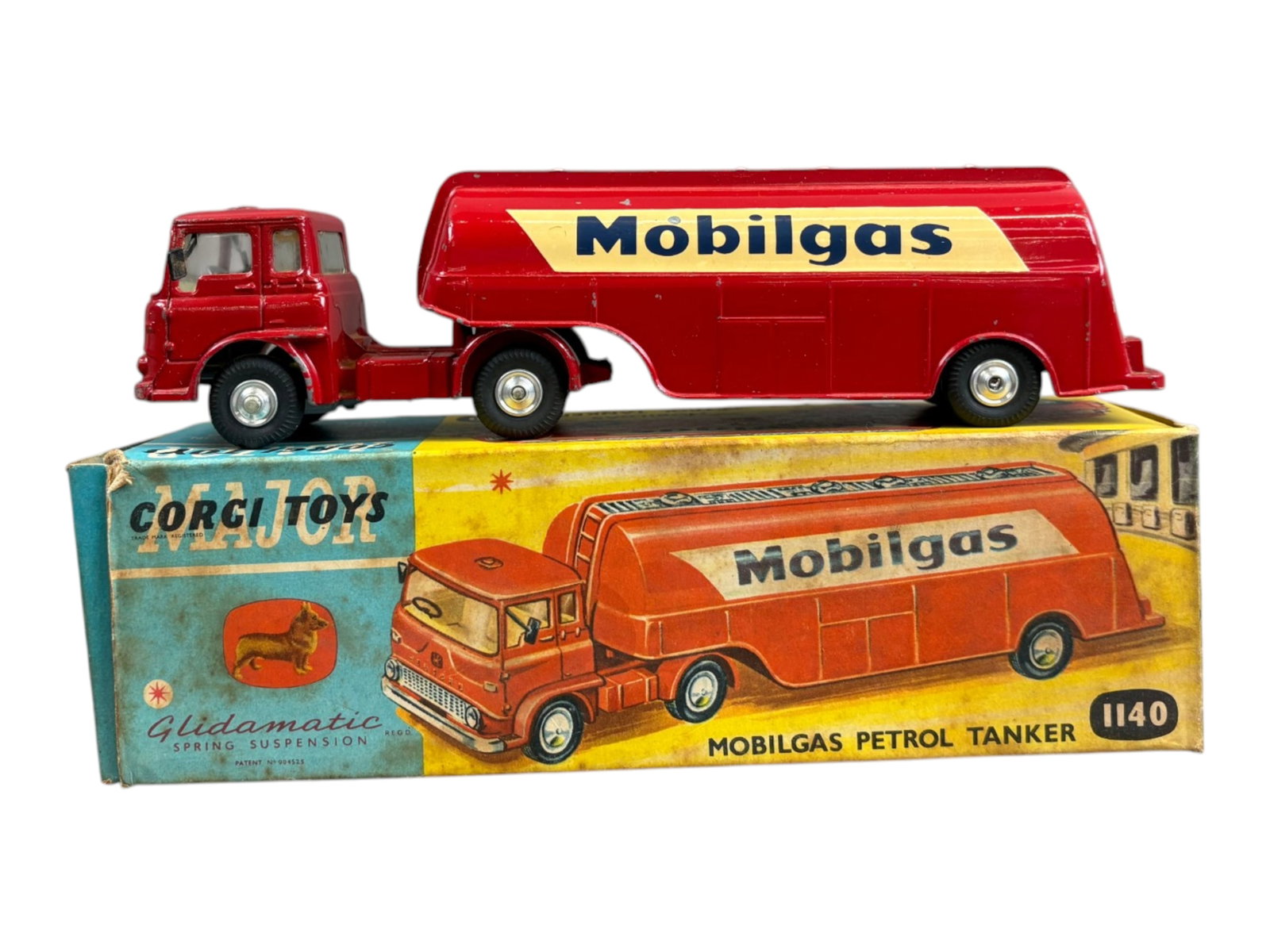 Corgi Toys 1140 Mobilgas Petrol Tanker w/Orig Box: Approx. 7-3/4" long. Shows playwear with some paint scuffs, and scratches. Comes in the original box which is a little dirty with some staining and soiling. Box insert is not present. Shipping: Weiss