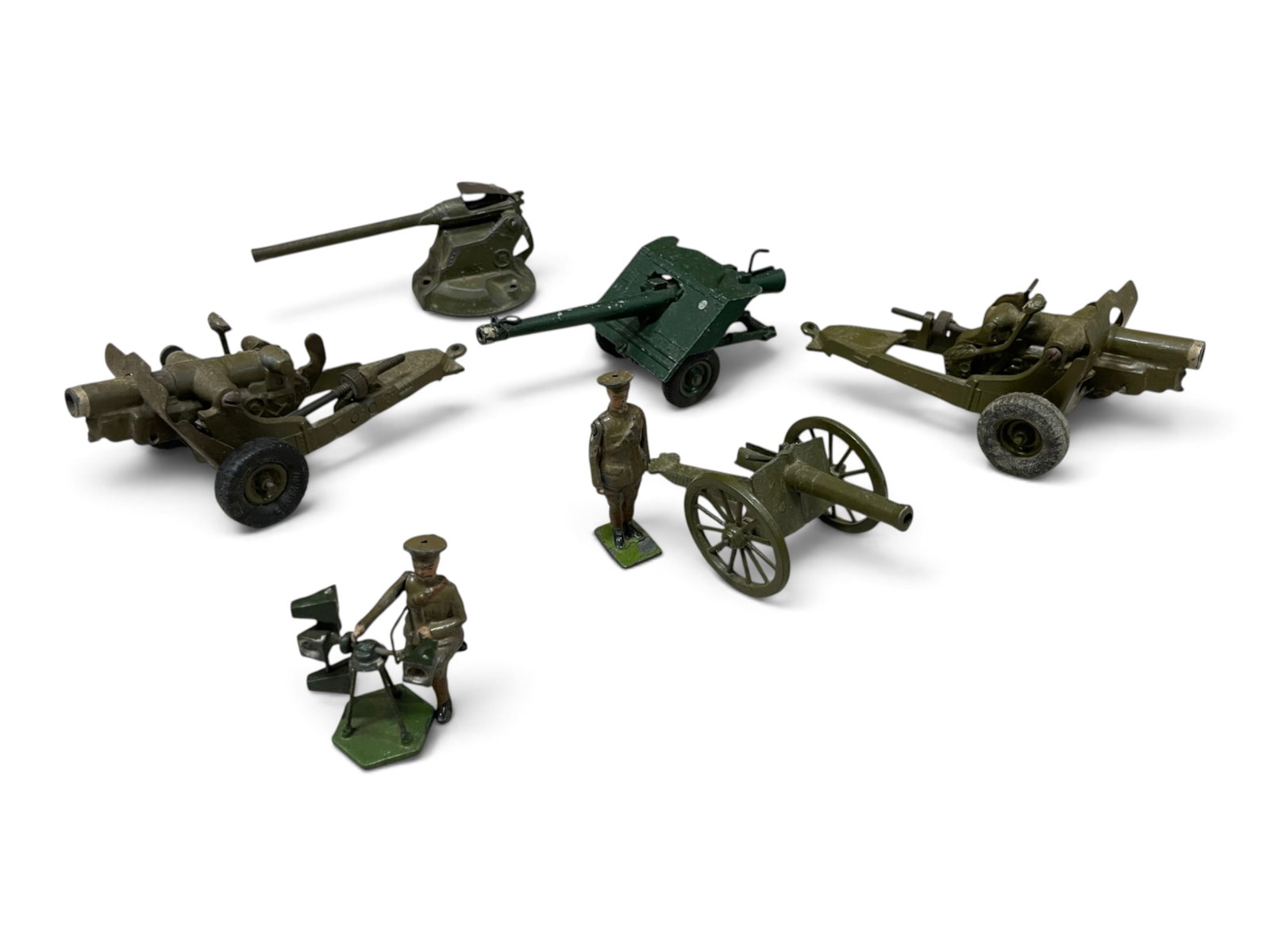 8pc Britains Military Lot: Includes 2 Howitzers; Cannon with officer; Soldier Kneeling with sounder; Anti-Tank gun; Naval Gun. All show light to moderate play wear. Shipping: Weiss Auctions offers full-service, in-house shippin