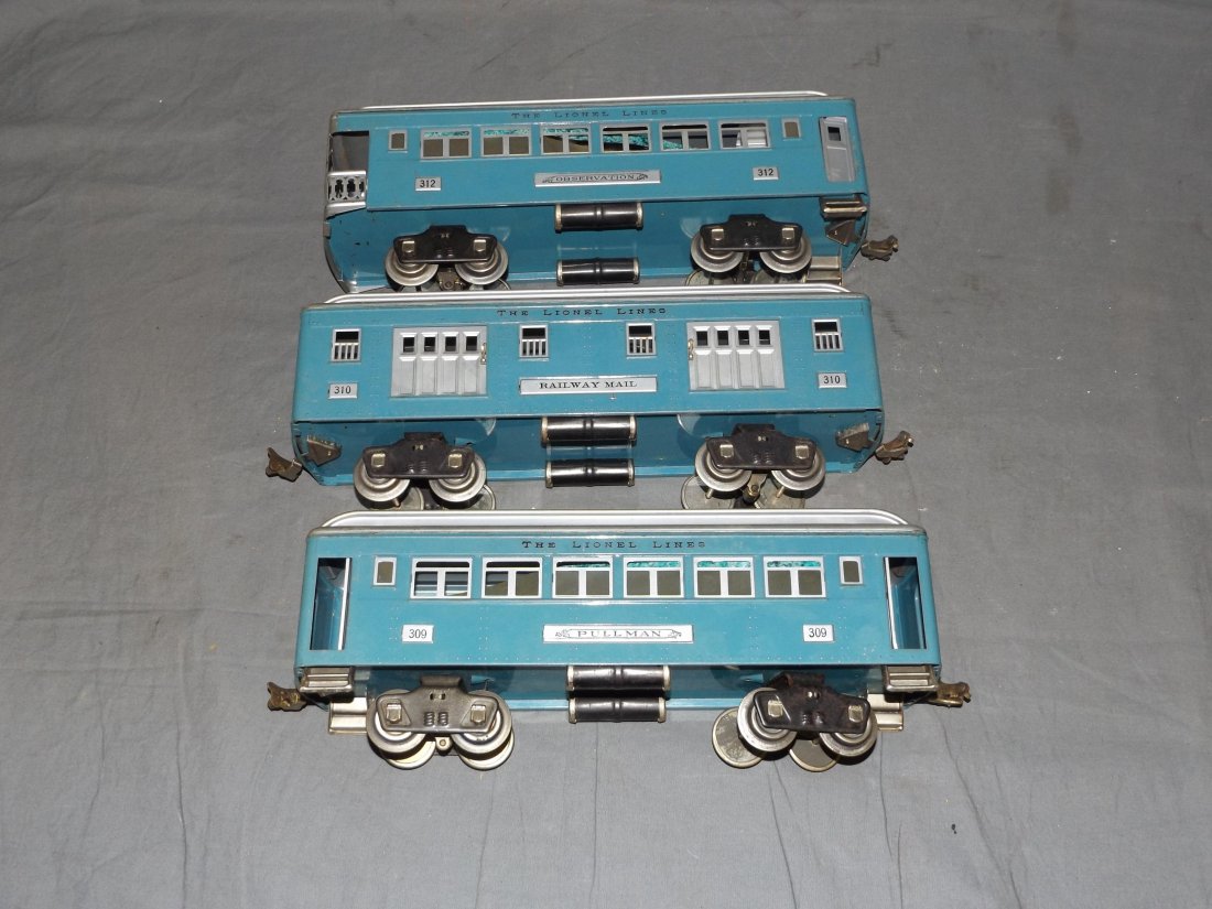Lionel Blue Passenger Cars 309, 310, 312: Prewar standard gauge blue passenger cars with aluminum roofs. Includes 312 observation car, 320 railway mail car, and 309 pullman car. Some scuffs and scratches to each. Examine.