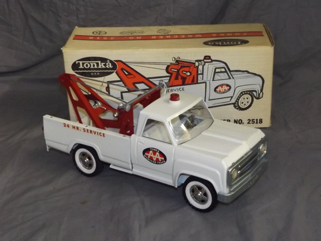 Tonka Wrecker Service Truck #2518 in Original Box: Pressed steel. LIke new in original box. Approx. 14.5" long. There are a few light paint scuffs spots, nothing major. Original decals are present. Comes in the original box which shows some wear. Box 