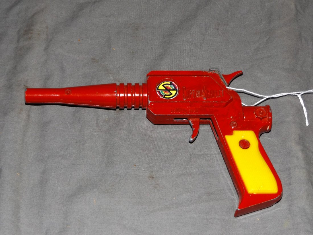 1960's Captain Scarlet Cap Gun, Lone Star Prod: Vintage Captain Scarlet Cap Gun by Lone Star Productions, circa 1960's. Approx. 7.25" long. Trigger works fine. Shows playwear with some paint scuffing and scratches.