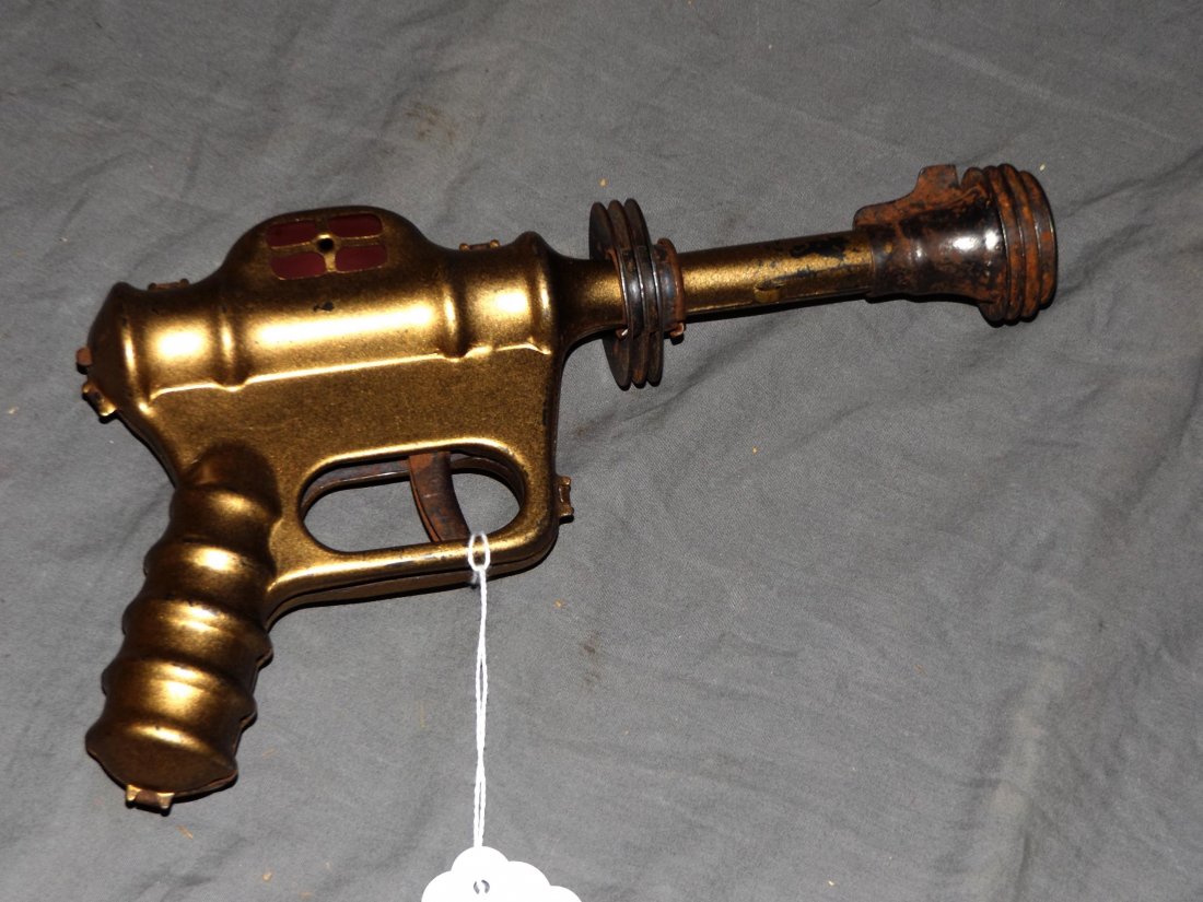 1930's Daisy Buck Rogers Atomic Pistol, Working: Vintage Buck Rogers Atomic Pistol, by Daisy, circa 1930's. Approx. 10" long. Red lenses. Working condition, when the trigger is pressed, a loud pop sound is made and the red lenses spark. Shows playwe