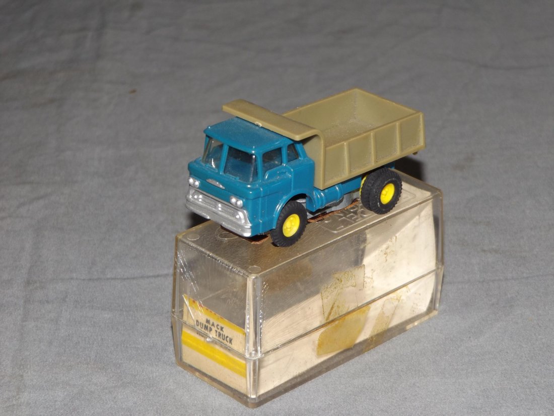 Aurora Vibrator #1582 Mack Dump Truck in Orig Box: Dark blue with gray bed. Original box with ID card. Working motor.