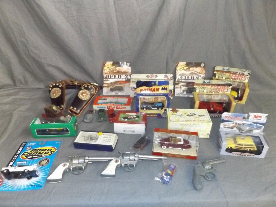 Mixed Toy Lot.: Includes Newer Boxed Die Cast Vehicles, Cap Guns, Early Dinky Cars etc. This lot is being sold on behalf of the Nassau County Public Administrators Office from the Estate of Robert Lee.