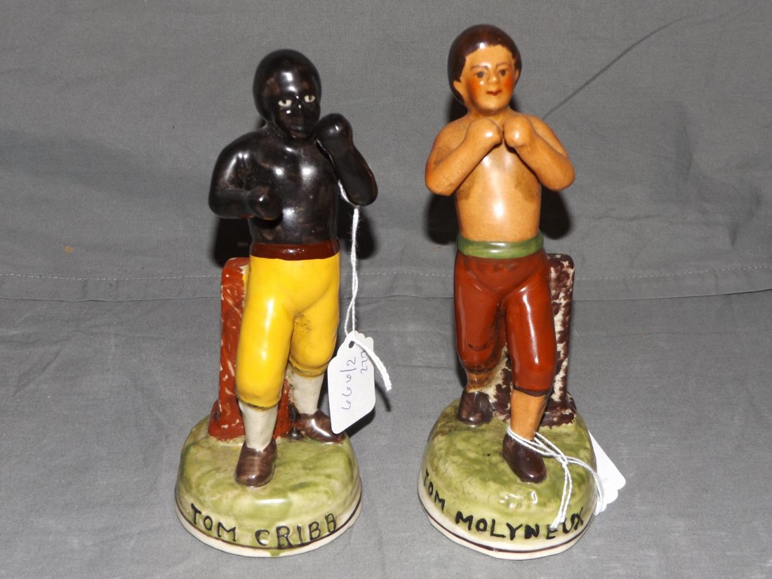 Staffordshire Boxing Figures. Molyneus/Cribb: ach approx 8" tall - one depicts boxer Tom Molyneus, the other Tom Cribb. Nice overall condition. Examine for value and bid accordingly.