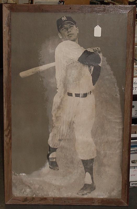 MICKEY MANTLE. FROM YANKEE STADIUM: ORIGINALLY DISPLAYED IN THE OLD YANKEE STADIUM. 29 X 48" PHOTO ON CARDBOARD PICTURE OF MICKEY SWINGING THE BAT. COMES WITH THE ORIGINAL WOODEN FRAME. A MUST FOR THE TRUE YANKEE FAN. THE PIECE IS IN NE