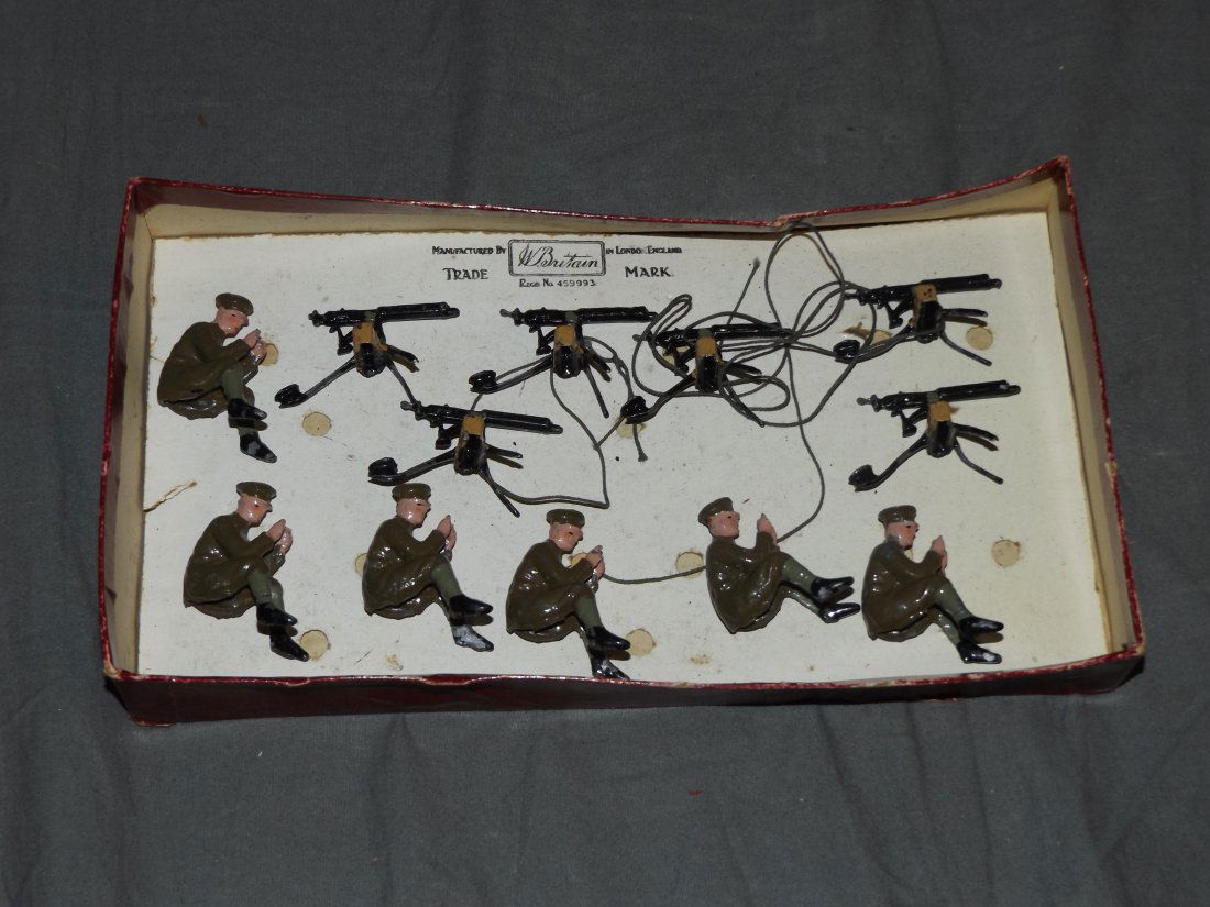 Britains: Set # 198 Machine Gun Section.: Rare early set 6 sitting and separate guns, in original “Flowers” box is rough. From the Howard P. Gries Collection.