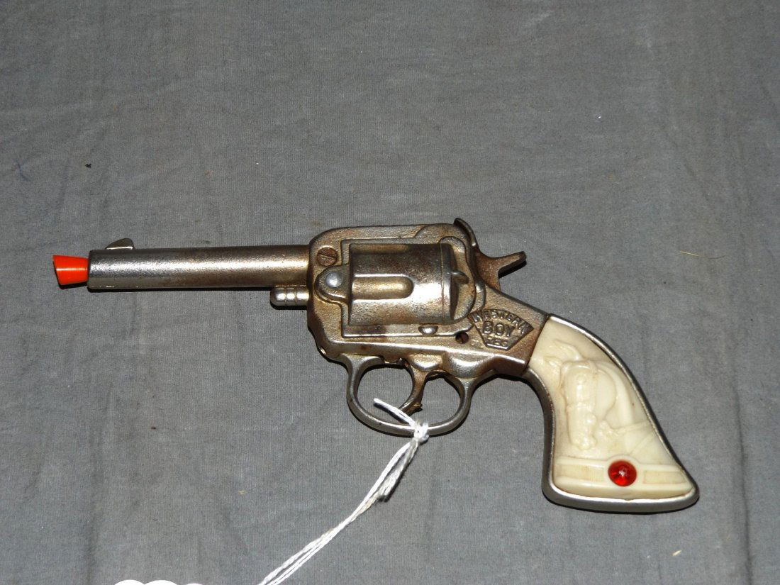 Stevens Cast Iron Western Boy Toy Cap Gun: Approx. 8" long. Plastic embossed grips. Trigger and hammer are both in working condition. Examine.