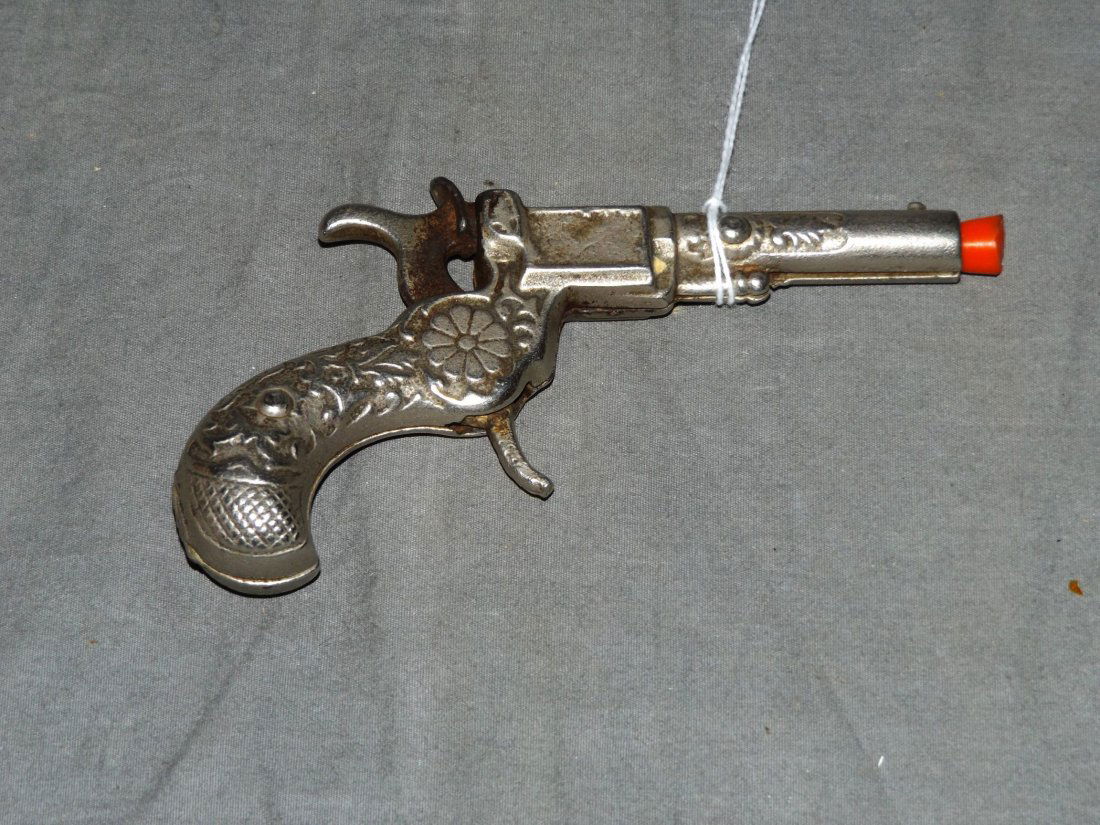 Vintage Stevens 888 Toy Cap Gun: Nickel plated. Approx. 4-3/4" long. Trigger and hammer in working condition.