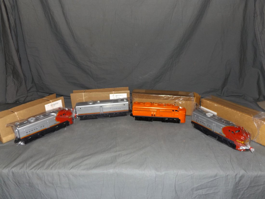 Lionel Lot of 4 Alco Diesels: Includes #212P Powered Santa Fe A Unit, #221T Dummy Santa Fe A Unit, #218C Dummy Santa Fe Unit, and #232 New Haven Powered A Unit.