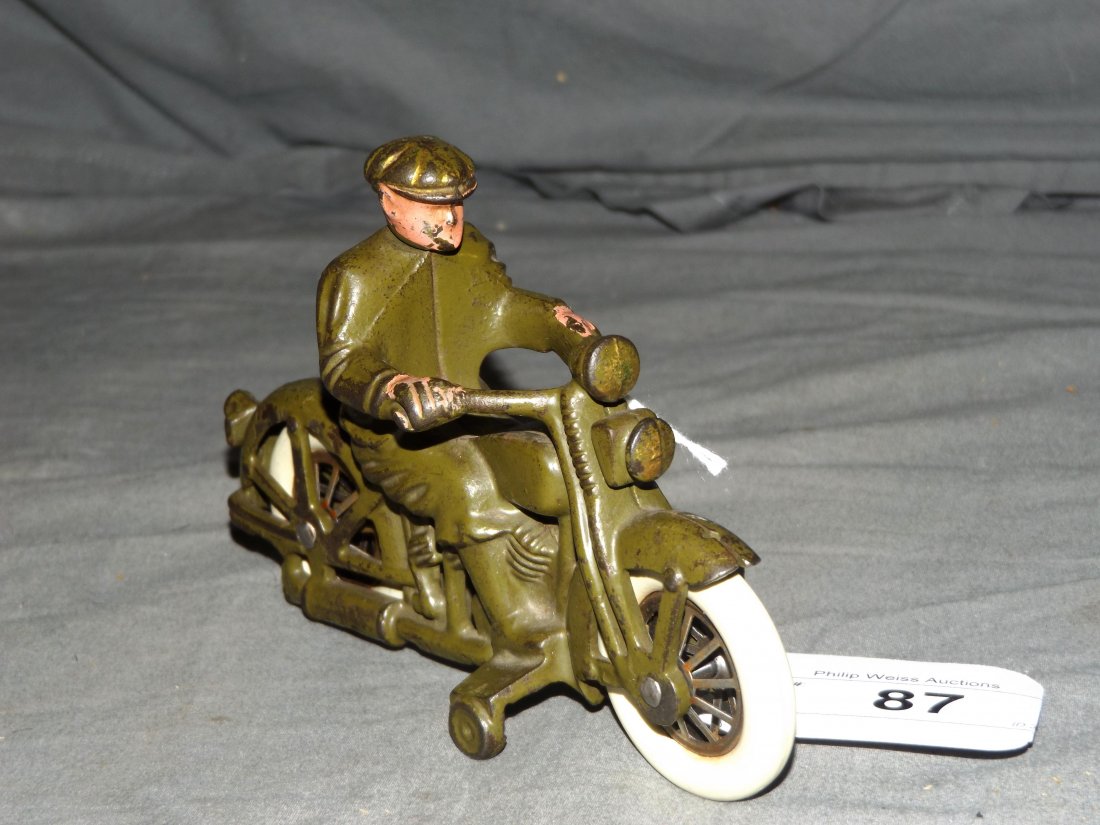 Cast Iron Hubley Harley Davidson w/Civilian Rider: Cast iron, painted in green overall with rubber tires, "Harley Davidson" in raised letters on tank. Approx. 6" long.