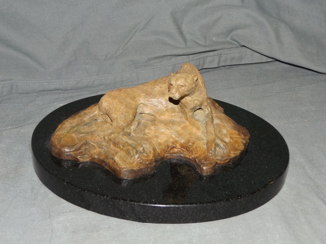 Richard MacDonald (born 1946) Bronze.: Cheetah Reclining. 8" x 6 1/4" without base 10 1/4" x 12 1/2" with base. Initialled and dated 96.