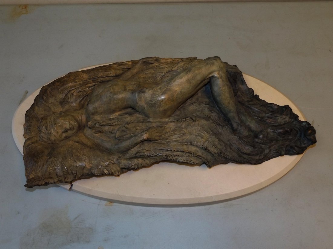Richard MacDonald (born 1946) Bronze.: Nude Laying Down. 26" long by 14" wide signed and dated 97. Numbered 32/150. Marble/Stone base broken but present can be repaired.