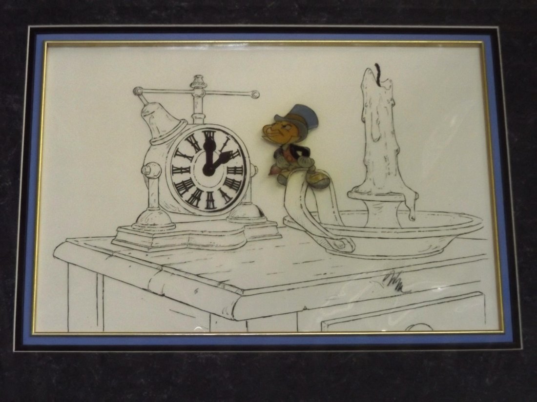 Disney. Mickeys Christmas Carol. 1983.: Jiminy Cricket with Ink Line Background 10" 1/2 x 15" sight size. With Seal. Cel is fading a bit with some paint lose from the back.