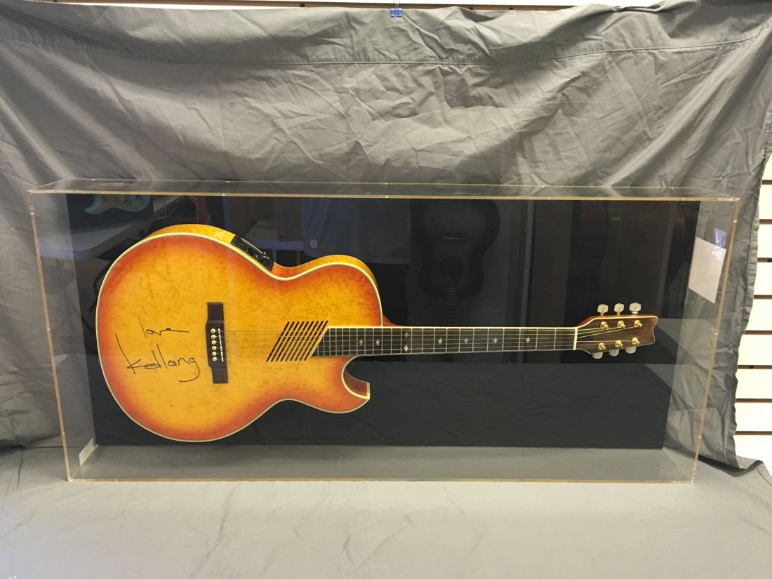 K.D. Laing Signed Washburn Guitar: K.D. Laing Signed Washburn guitar in plexiglass display, signed in person for KISS 108 owner Richie Balsbaugh