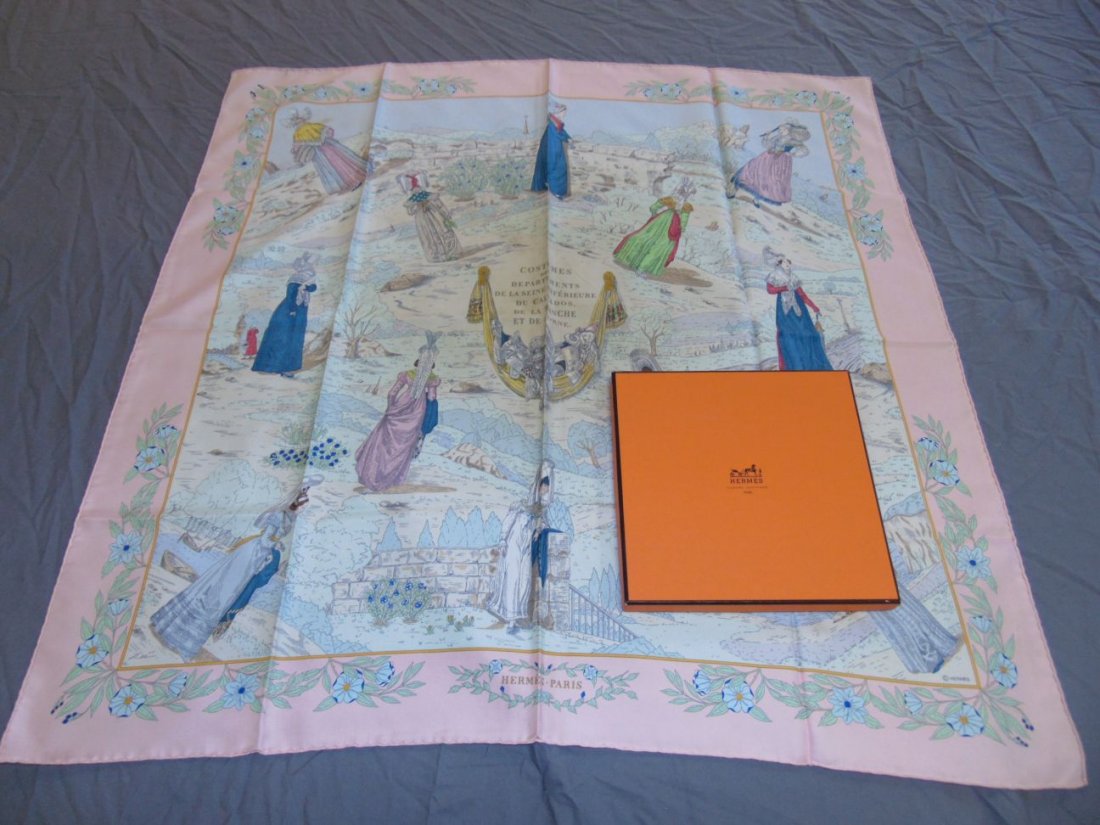 Hermes Silk Scarf "Costumes de Departments..."+box: Hermes Silk Scarf - "Costumes des Departments De La Seine Inferieure Du Calvados, De La Manche Et De L'orne" Printed Silk - 35" X 35". Labeled within design. Item has a vintage perfume aroma. Some dis