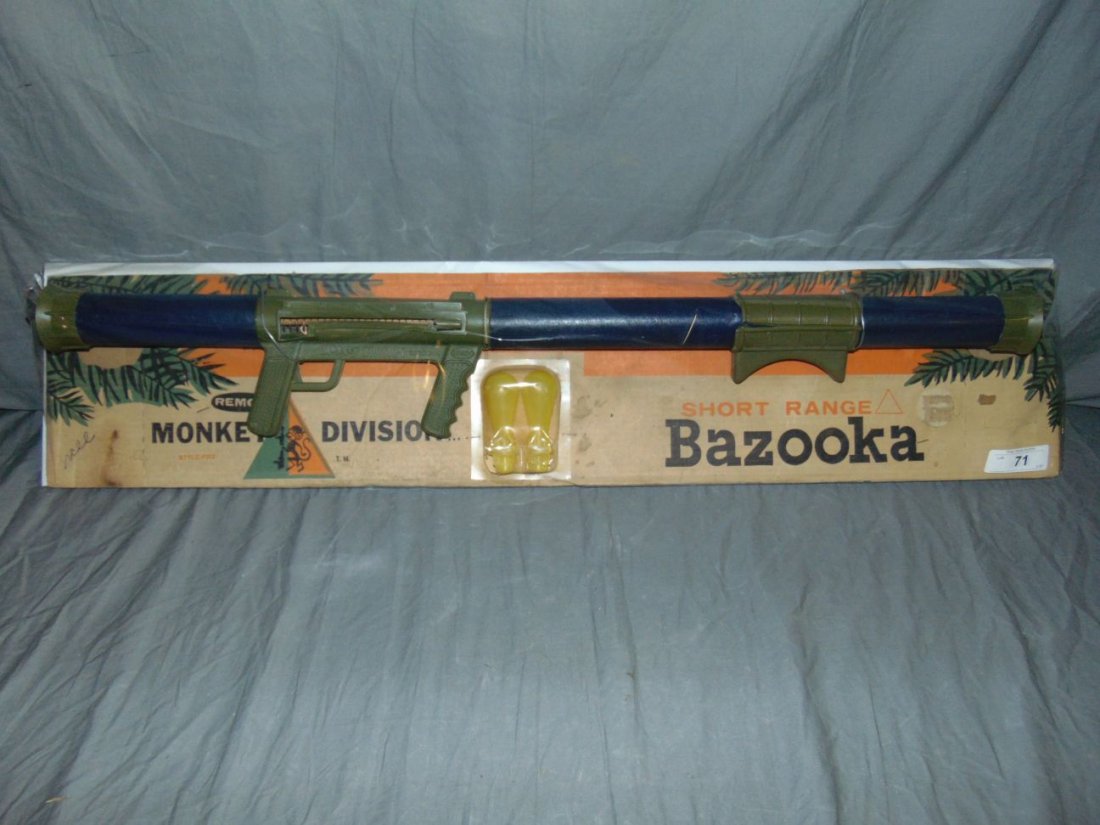 Remco Monkey Division Short Range Bazooka on Card: Vintage Remco Monkey Division Short Range Bazooka. Unsure if used, however there is some wear and damage from storage. Some areas of the plastic are cracked and warped. Just above the handle with trig