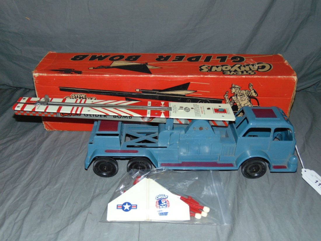 1950's Boxed Steve Canyon Glider Bomb, Ideal: Lot consists of Steve Canyon's Glider Bomb by Ideal, 1958. Excellent condition. The 3 glider pieces show some light wear with a few scuffs, and light cracks. Comes in the original box which shows wear