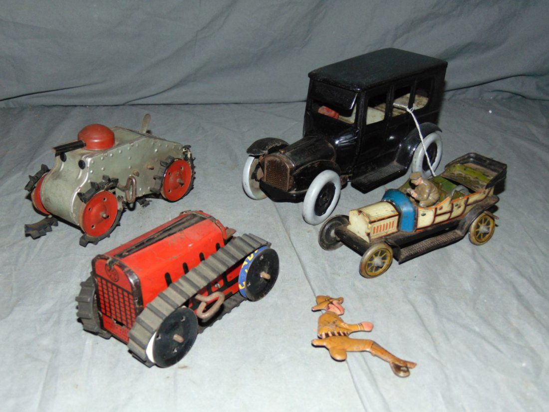 Mixed Toy Vehicle Lot: Includes Marx tank and Tractor (both with broken tracks), back car appears to be Strauss Leaping Lena (repainted), and another tin litho car. All show some wear. Examine