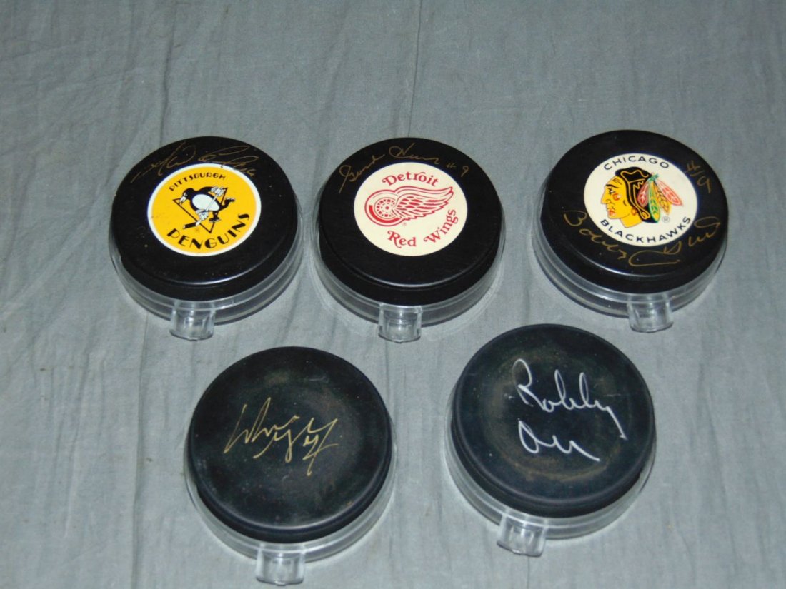 Lot of Five Signed Hockey Pucks.: Includes Hall of Famers, Howe, Orr, Gretzky, Lemieux and Hull.