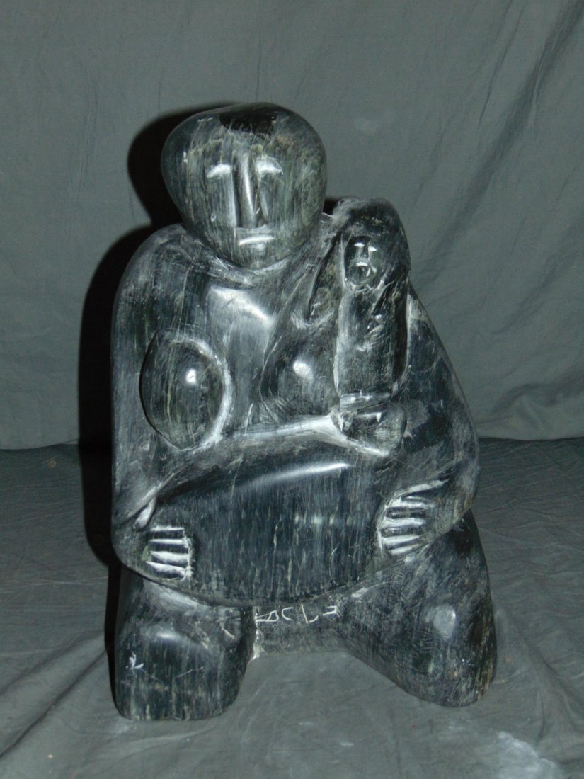 Inuit Scuplture.: Native Woman Nursing her baby. 15" tall and 10" across