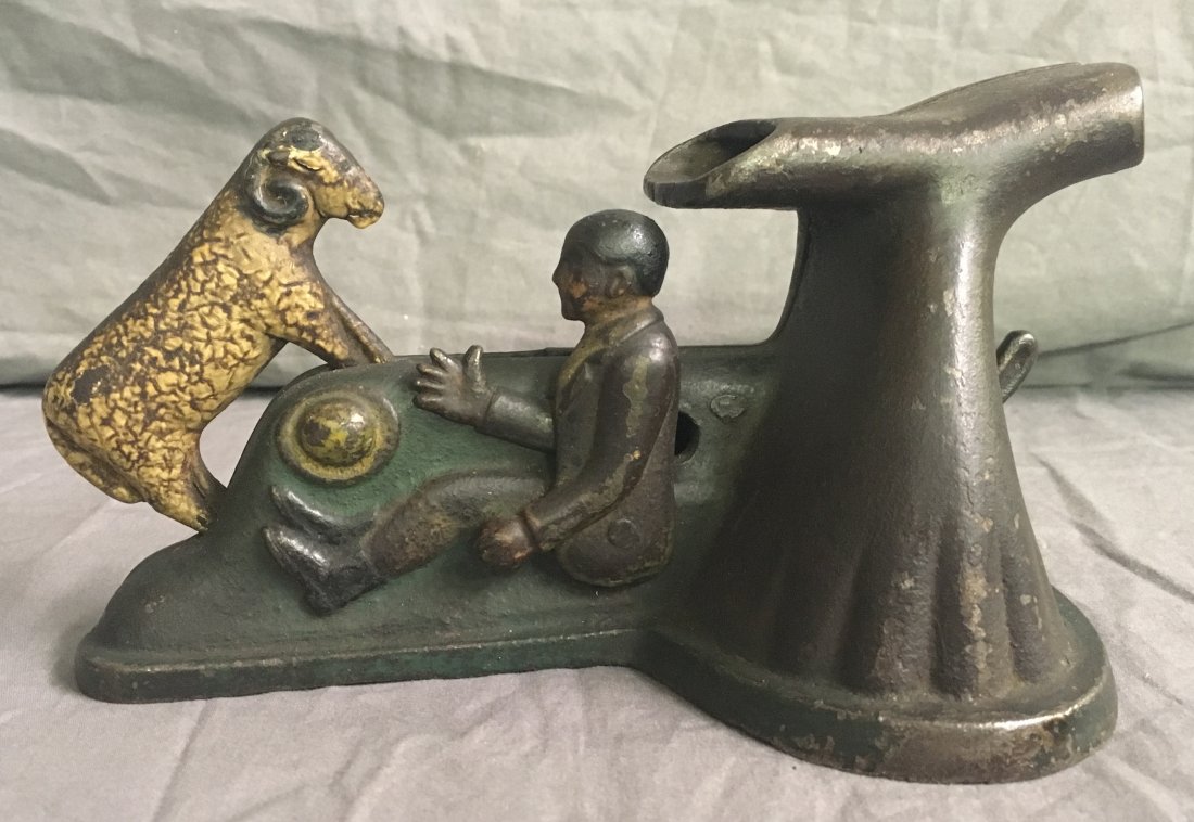 Rare. Butting Ram Mechanical Bank: Mfg. attributed to Wagner and Zwiebel Machine Shop, WI, designed by Ole O. Storle, Patented 1895, cast iron, scarce example, coin is placed in front of tree, pressing lever causes ram to butt into tre