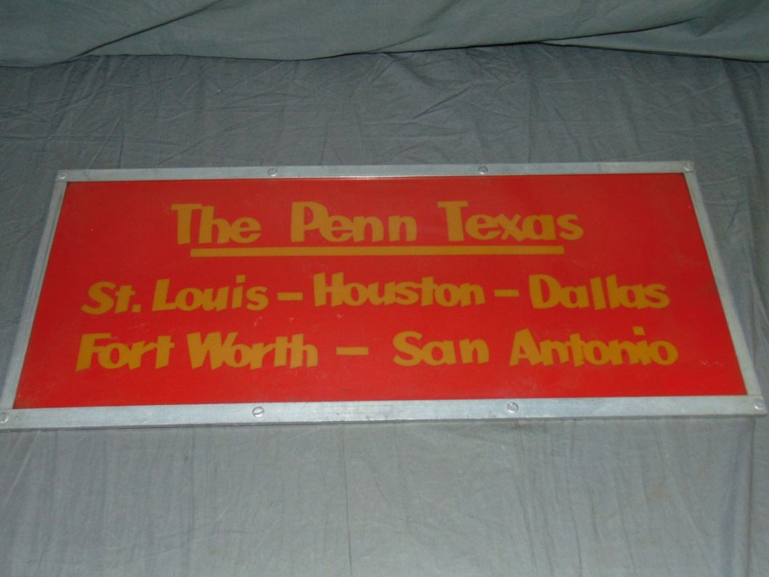 Penn - Texas Destination Railroad Sign: Vintage Penn - Texas Destination Railroad Sign. "St. Louis - Houston - Dallas - Fort Worth - San Antonio". Approx. 27-1/4" x 12". Plexiglass sign in metal frame. Some surface scuffs and scratches.
