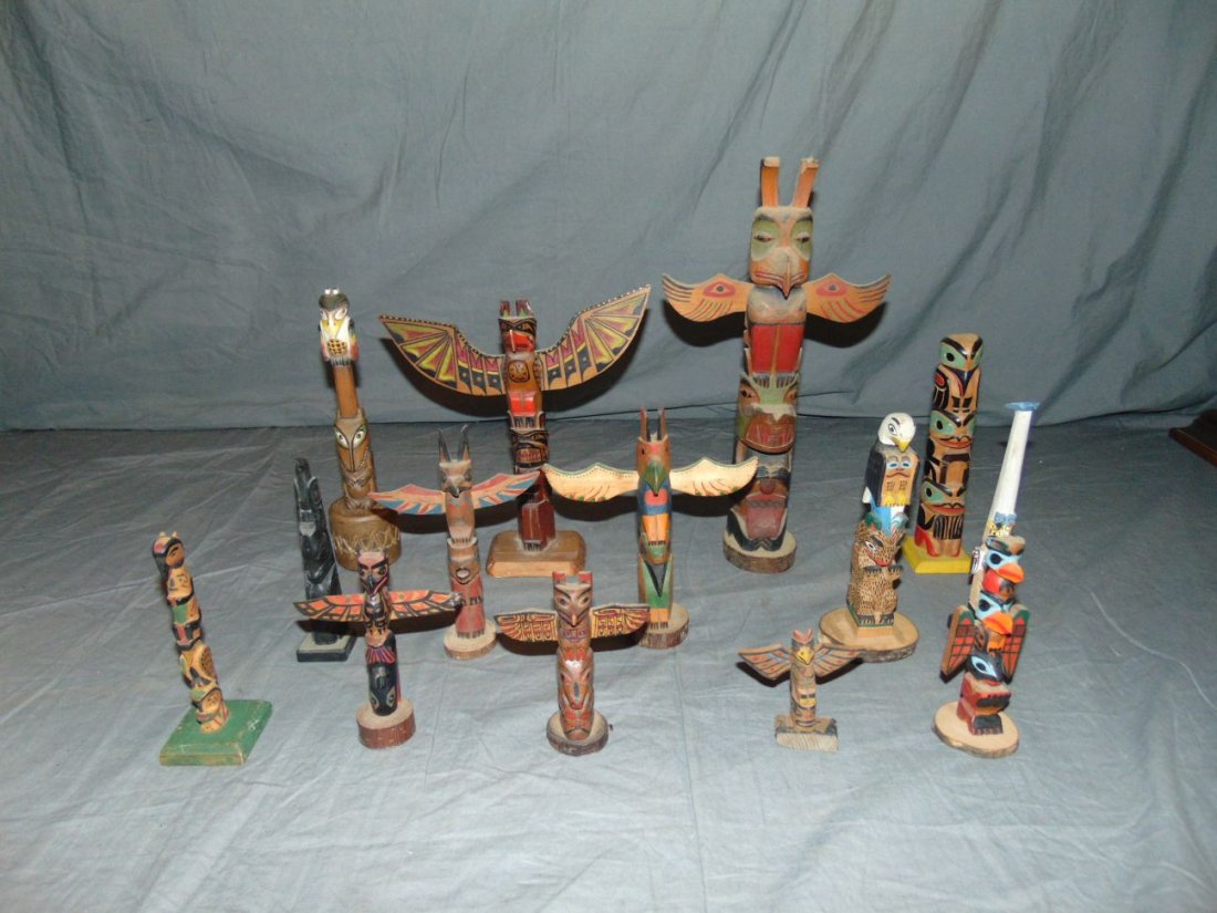 Lot of 14 Totem Poles.: All Painted Wood various sizes, some signed. The largest is 12"
