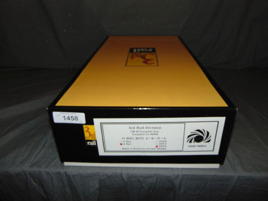 Boxed 3rd Rail Sunset Brass Big Boy Loco & Tender: O Scale, made in Korea. Big Boy 4-8-8-4, No. 4009. Factory painted. Steam loco and tender. Appears to be unplayed with, both pieces are still factory wrapped. Comes in the original box.