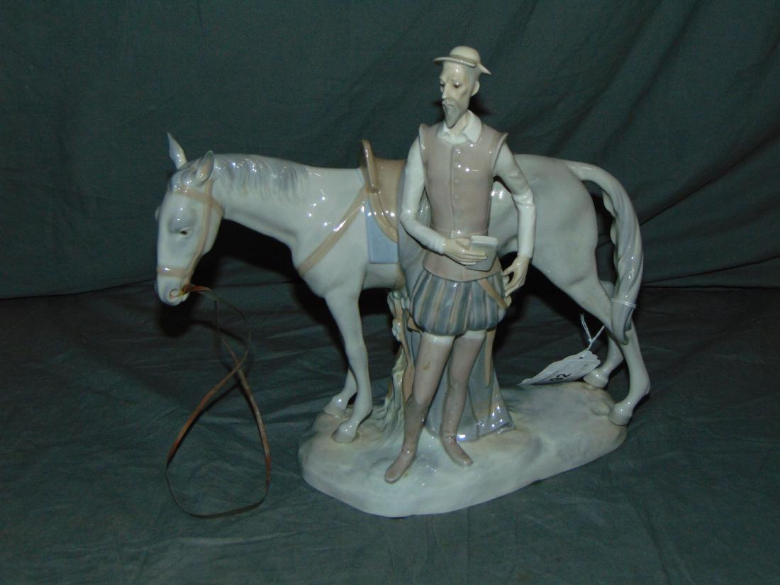 Spanish Porcelain Figurine. Horse and Don Quixoti: Lot includes a porcelain statue of a standing horse with Don Quixote standing beside.11.5" tall, 12" wide on base. Stamped Made in Spain # 310 on bottom. Nice overall condition. Examine