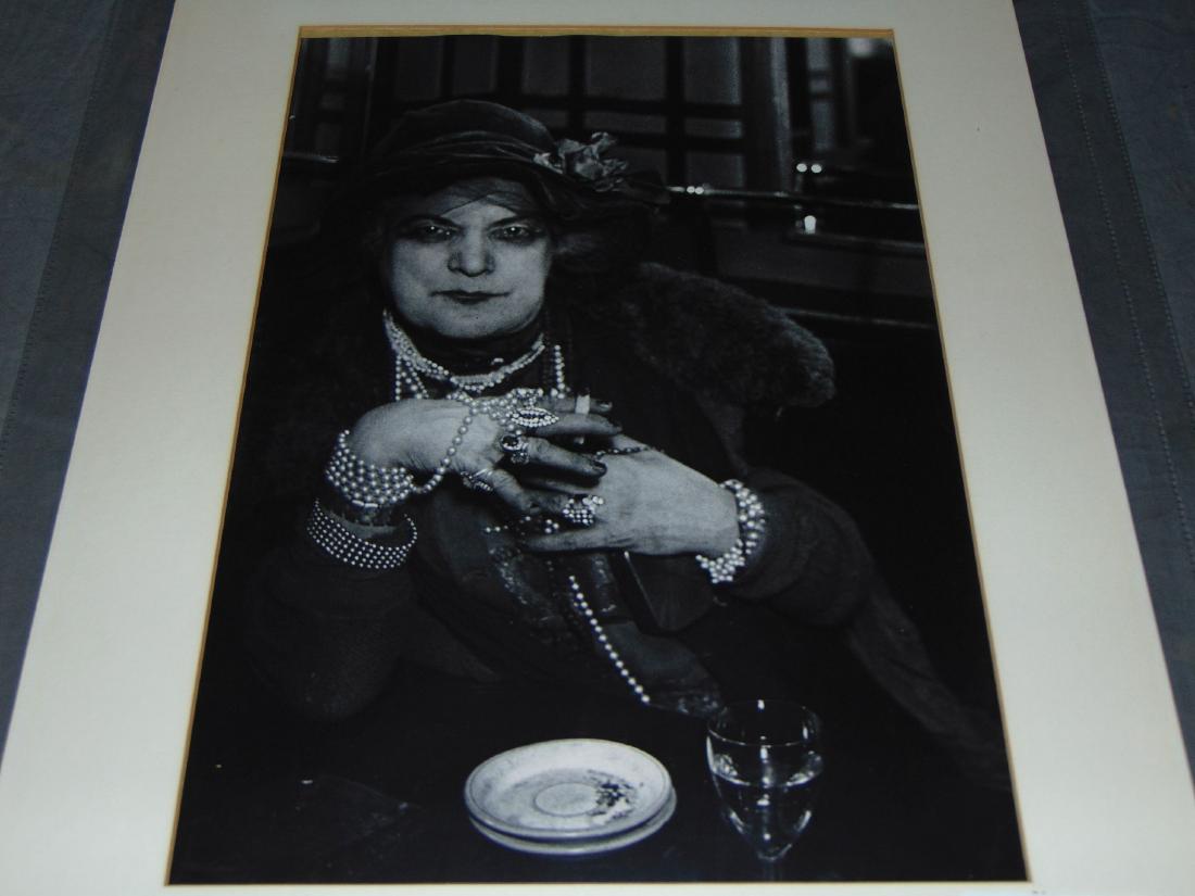 Brassai Photo, Madame Bijou, Circa1932: Original photo by Brassai depicting Madame in the Bar de la Lune, Paris, circa 1932. Gelatin silver print, printed later. Stamped and pencil signed PP.384 on the verso. Photo approx. 11" x 15.5". Some