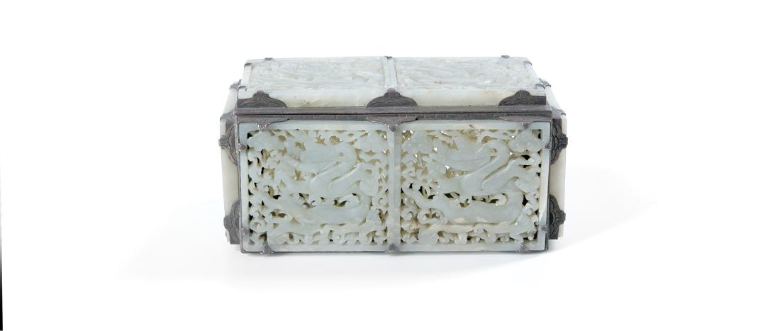 A LARGE SILVER BOX MOUNTED WITH EIGHT CARVED DRAGON: A large silver box mounted with eight carved dragon yuan/ming dynasty 'edward farmer' mark. Qing dynasty 19th century.Height 3.2 in. (8.1 cm.) Length 6.7 in. (17 cm.) Width 3.7 in. (9.4 cm.)