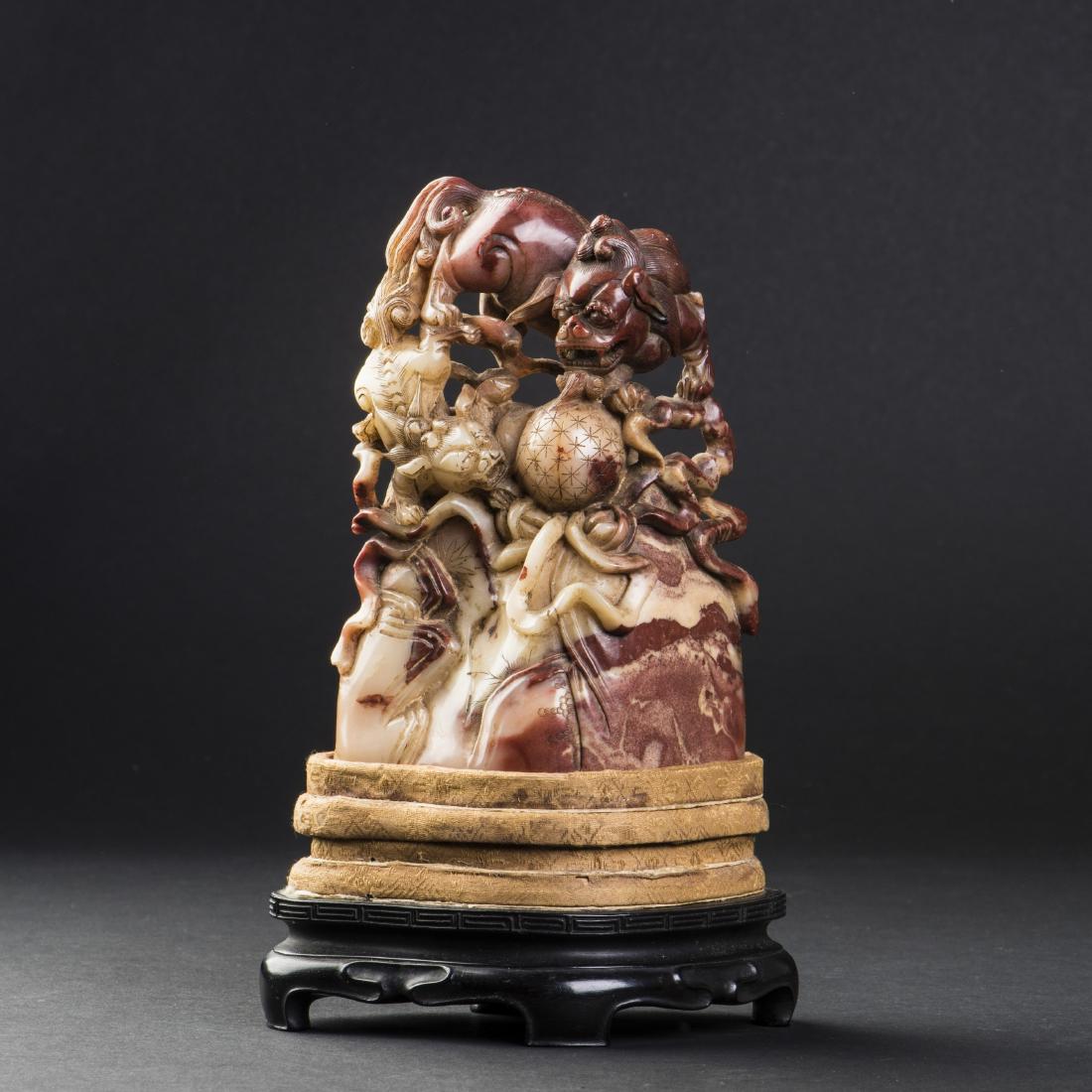 A SOAPSTONE SEAL, 19TH CENTURY: A soapstone seal. 19th century. Height 5.5 in. (14 cm.) Length 2 in. (5.1 cm.) Width 4 in. (10.2 cm.)