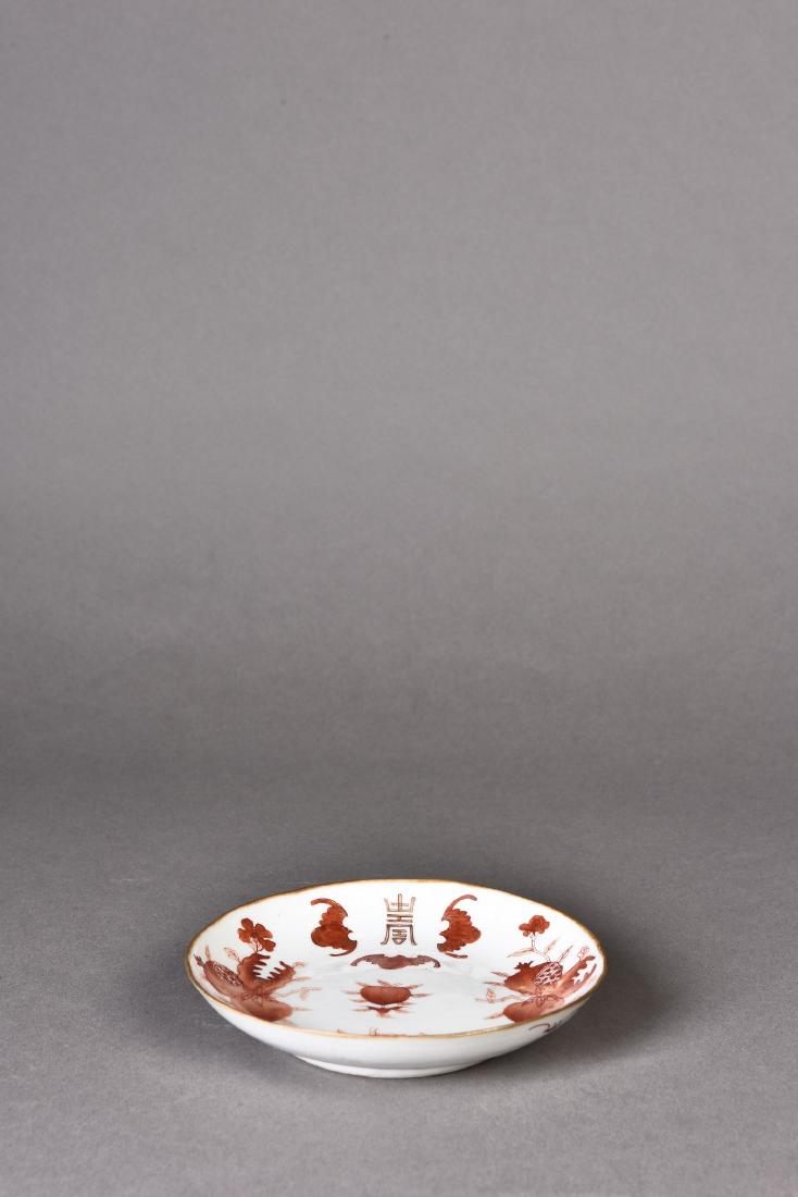 A FU SHOU PORCELAIN SHALLOW DISH: Hand-painted shallow dish depicting auspicious 'Shou' bat, peach and pomegranate. Height 11 in. Diameter 5.5 in.