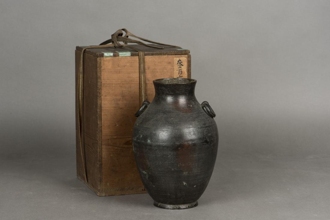 A BRONZE CENSER: Of a rounded form, shoulder flanked by pair of loose rings, with a Japanese wood box. Height 23cm Width 15cm