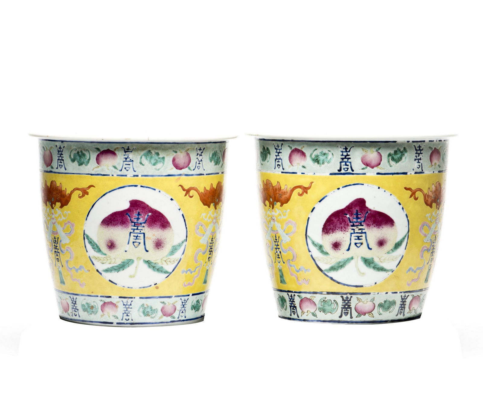 A PAIR OF FAMILLE ROSE 'LONGEVITY PEACH' JARDINIERES,: Well potted with longevity bats and peaches depicted in different stages of ripeness from light yellowish green to rose-pink deepening to darker pink spots and patches, yellow ground on body and turqu