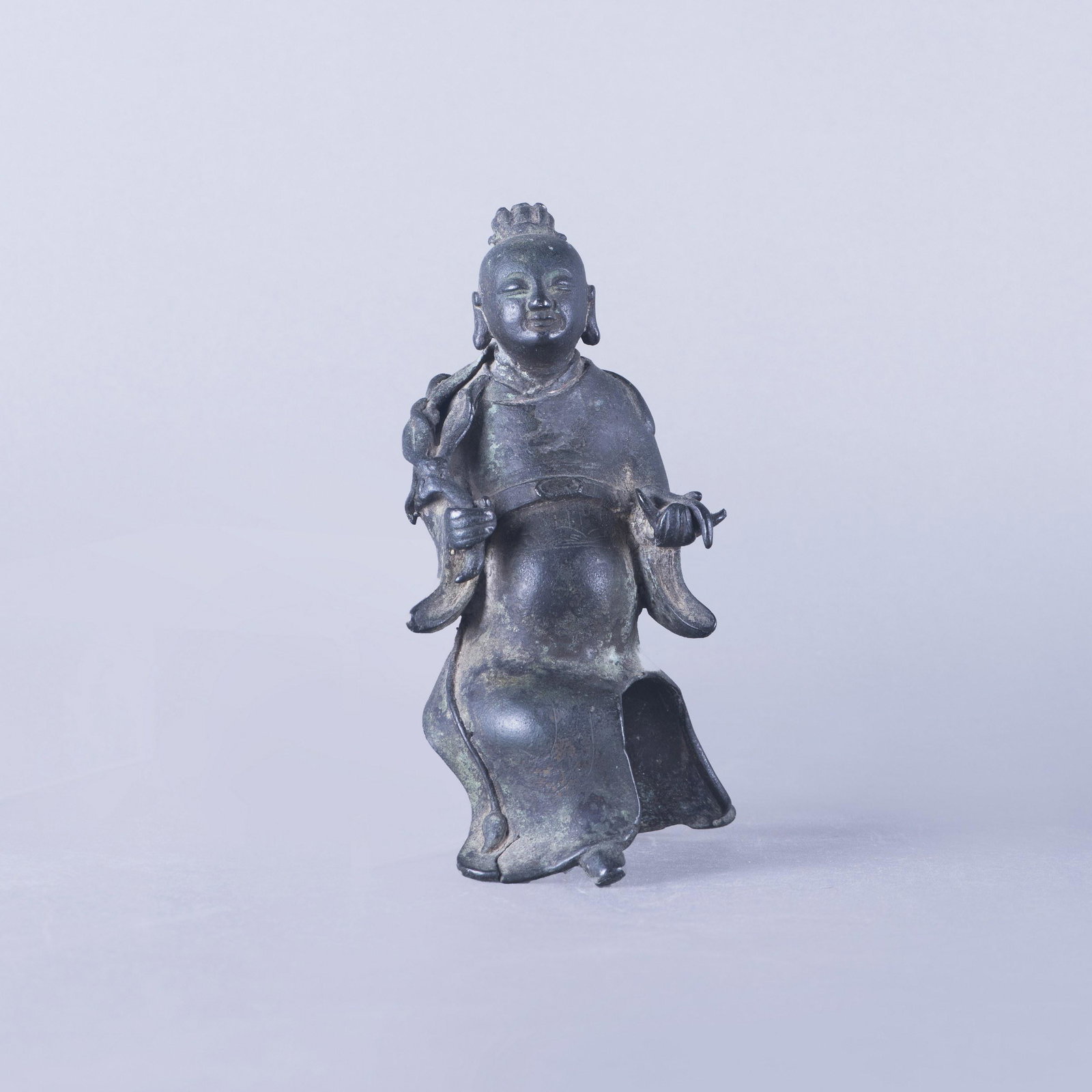 A BRONZE FIGURE OF BUDDHA, MING DYNASTY: A bronze figure of Buddha. PROVENANCE: Collection from Dr. Harrison and his wife back in 1940s when they were ambassadors in China. H 14 x 16 cm