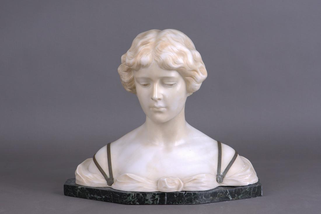 AN ART DECO ALABASTER, BRONZE YOUNG WOMAN BUST: Signed art deco alabaster and bronze bust sculpture. Depicts the bust statue of a young woman with shoulder straps crafted of metal. They feature repousse decoration. The bust is fixed to a granite ba