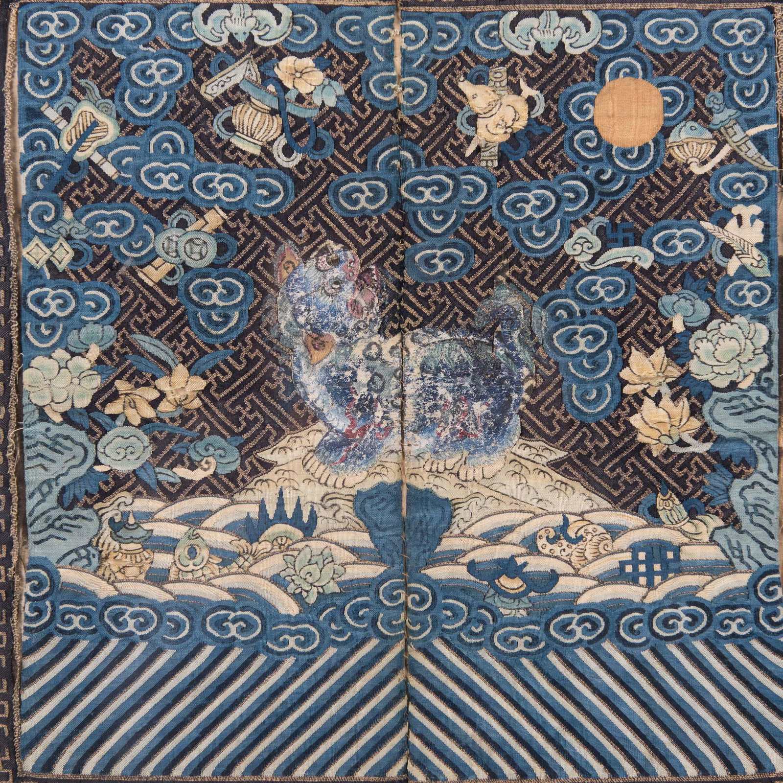 A CHINESE EMBROIDERED LION WITH FRAME: A Chinese embroidered lion with frame. H28x28cm