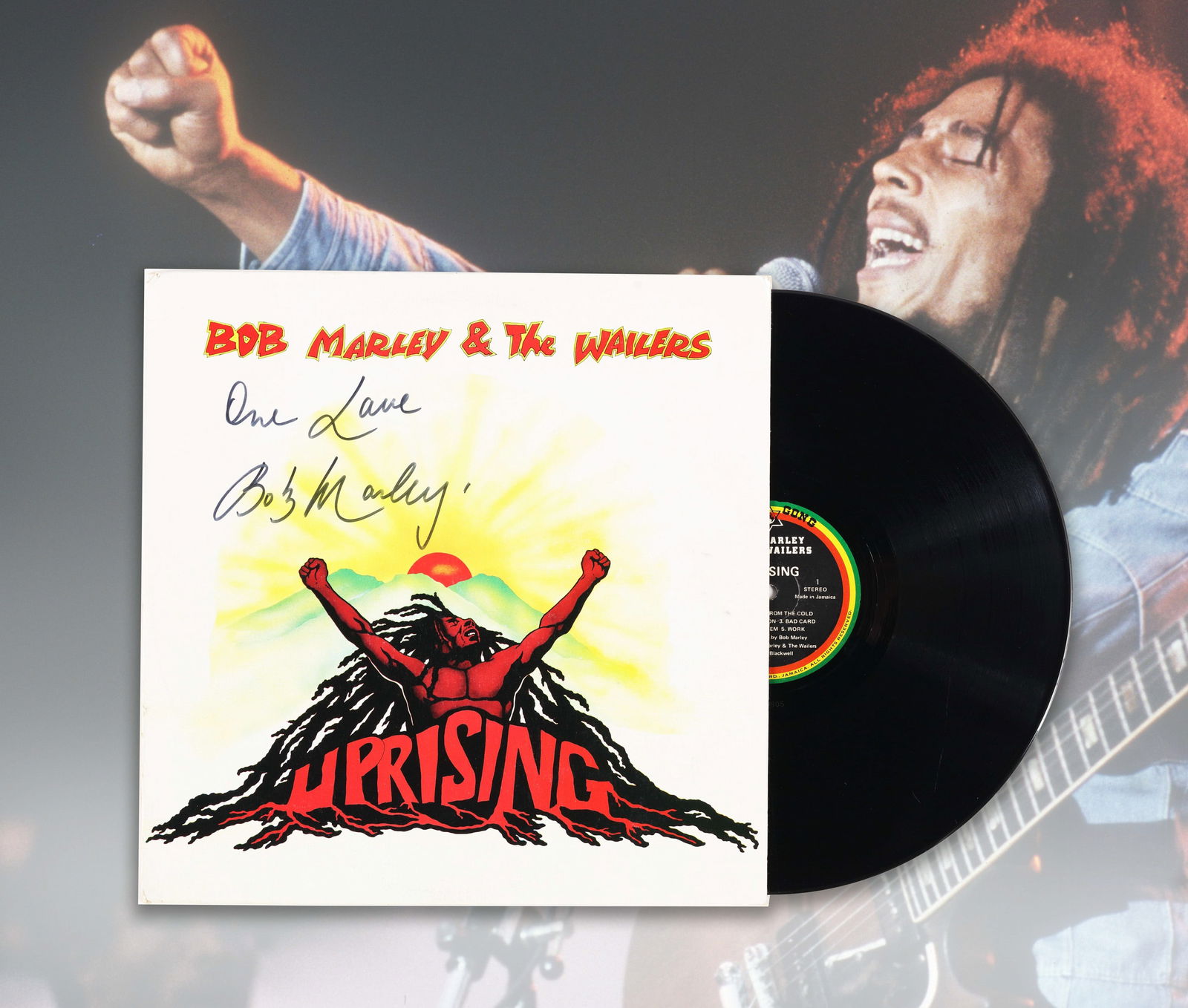 BOB MARLEY VINYL RECORD 'UPRISING' BEARING SIGNATURE AND INSCRIPTION: Vinyl record 'Uprising'. Released by Island Records in 1980. The cover features a graphic based on Bob Marley. The cover bears a signature in black marker reading 'Bob Marley' and is inscribed 'one lo