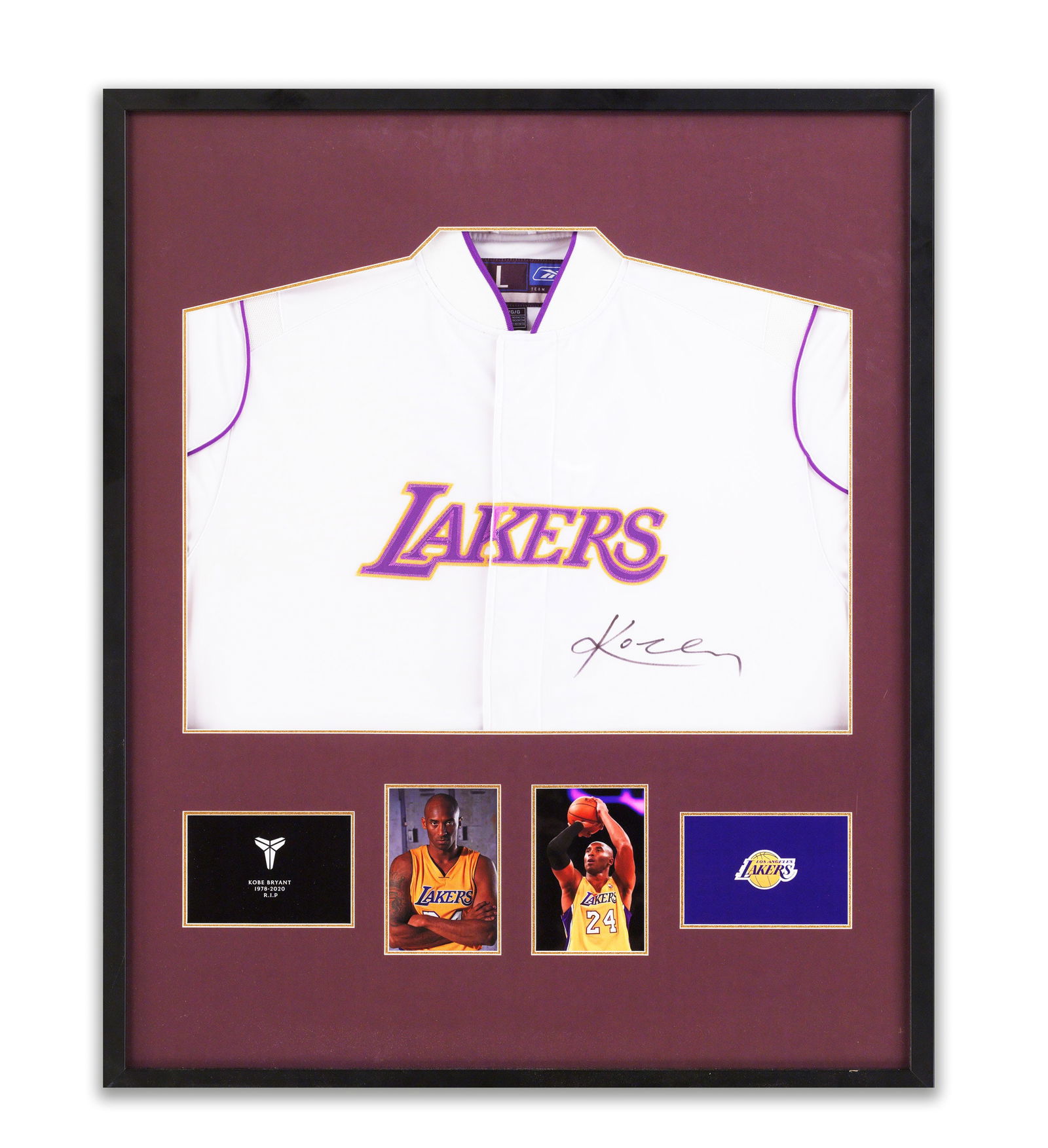 LAKERS WARMUP JACKET BEARING SIGNATURE READING 'KOBE BRYANT': Warmup jacket (2004). Bears a signature reading 'Kobe Bryant'. Dimensions: Outer frame size: 35.5 x 29.5 inches. Note: This signed Los Angeles Lakers jersey holds immense collectible and commemorative